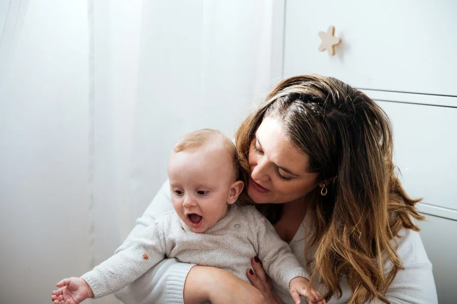 Mother and baby laughing